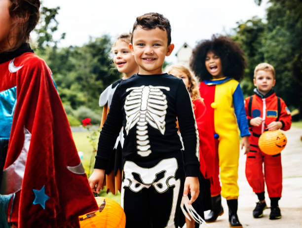 istock Young kids trick or treating during Halloween 1056229352