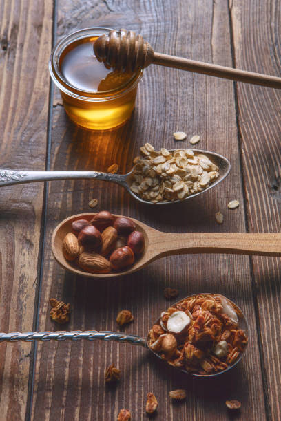 Still life with spoons. Nuts Honey.