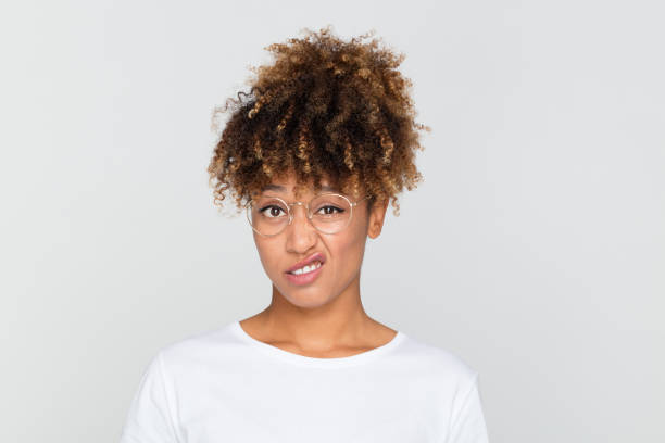 istock Young afro american woman looking disgusted 1056239508