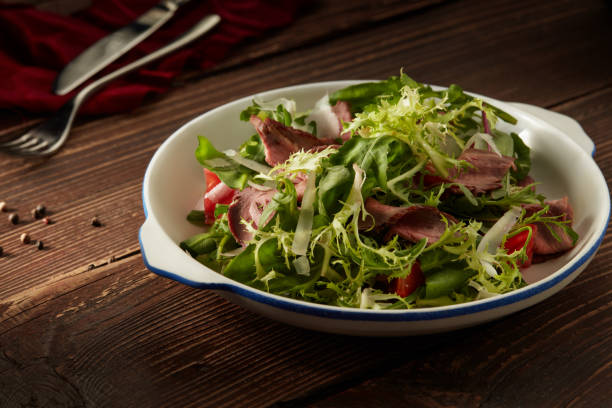 istock Warm salad with veal. 1056244194