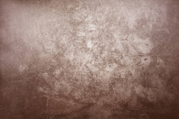istock grunge brown cement wall and background 1056245094