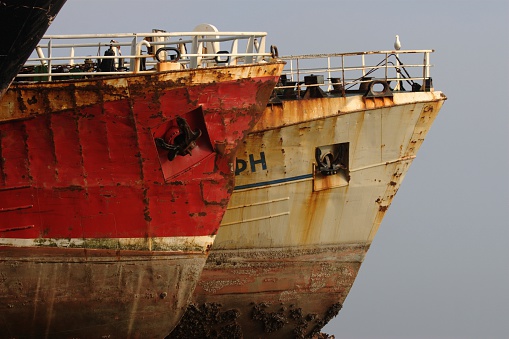 An old shipwreck or abandoned shipwreck. Wrecked boat abandoned stand on beach or Shipwrecked  near Cape Tarkhankut, the peninsula of Crimea.