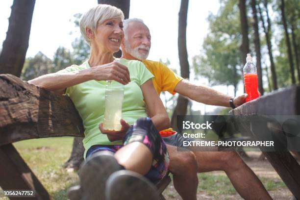 Senior Couple Outdoors Stock Photo - Download Image Now - Energy Drink, Anti Aging, Bottle