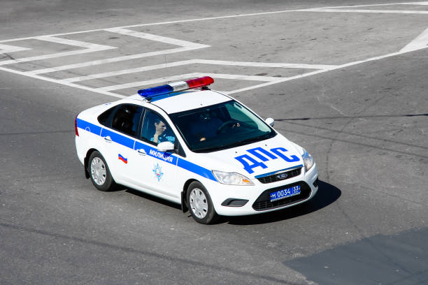 Ford Focus Vladimir, Russia - August 24, 2011: Police car Ford Focus in the city street. ford crossing stock pictures, royalty-free photos & images