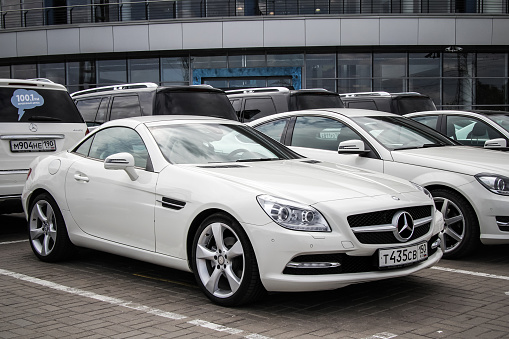 Moscow, Russia - June 2, 2012: White brand new sportscar Mercedes-Benz R172 SLK-class in the city street.