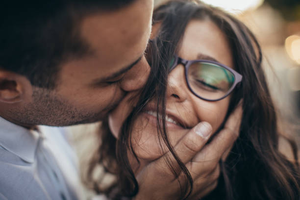 istock Beautiful young couple kissing 1056250782
