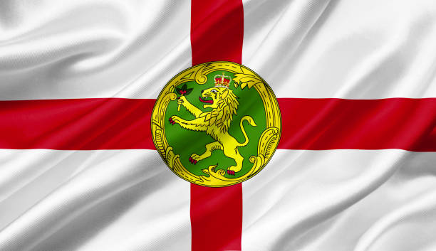 istock Alderney flag waving with the wind, 3D illustration. 1056254290