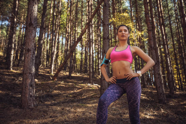 istock Sporty woman standing in forest 1056256040