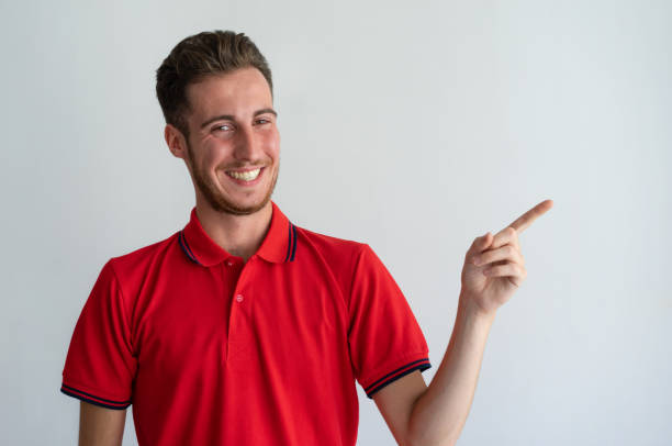 Cheerful guy showing new product, service, offer