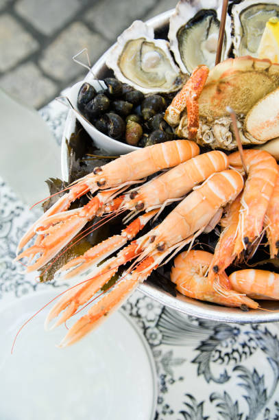 istock Plate with fresh assorted seafood in french summer restaurant 1056257532