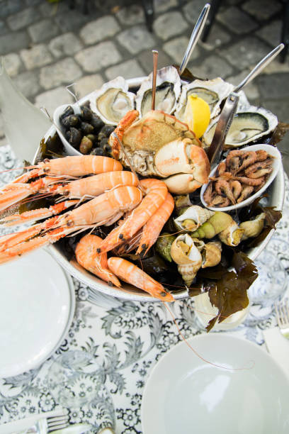 istock Plate with fresh assorted seafood in french summer restaurant 1056257542