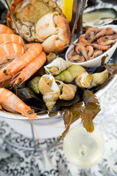 istock Plate with fresh assorted seafood in french summer restaurant 1056257554