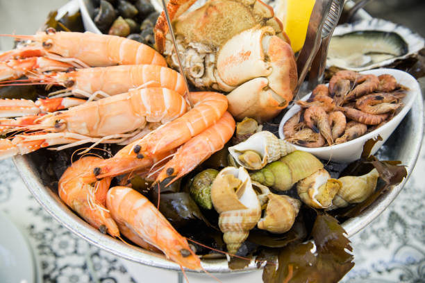 istock Plate with fresh assorted seafood in french summer restaurant. Close up image 1056257556
