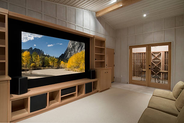 home theater home theater with wine tasting room, big screen, wood cabinets,photo on screen is one of my shots from yosemite entertainment center stock pictures, royalty-free photos & images