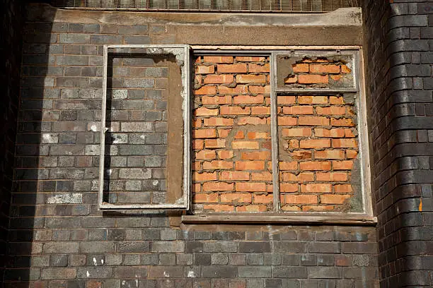 This bricked up window in an old warehouse in Bristol UK looks surreal and a bit sinister.