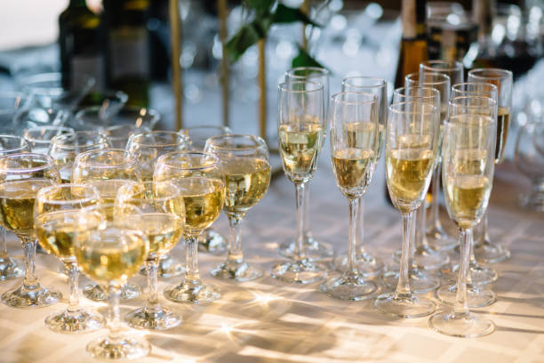 istock Festive table setting with champagne. champagne glasses close up. 1056263202