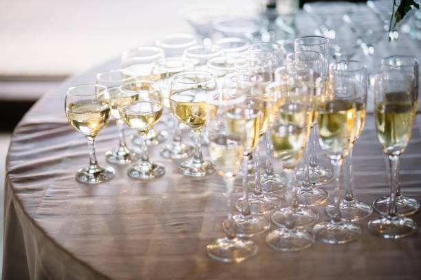 istock Festive table setting with champagne. champagne glasses close up. 1056263208