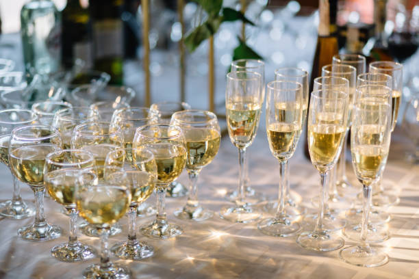 istock Festive table setting with champagne. champagne glasses close up. 1056263212