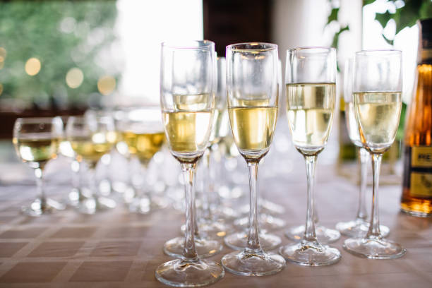 istock Festive table setting with champagne. champagne glasses close up. 1056263396