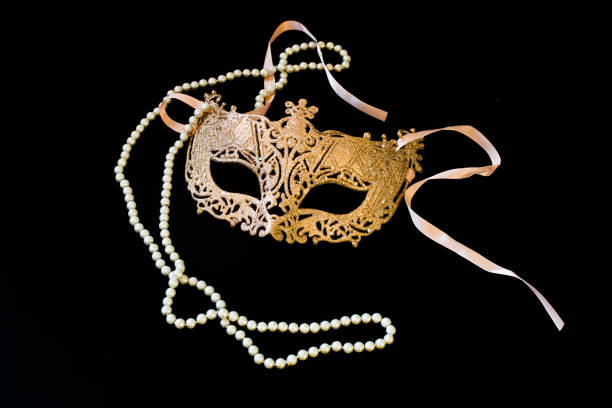 istock carnival, golden mask on a black background. ball, fun. 1056270640
