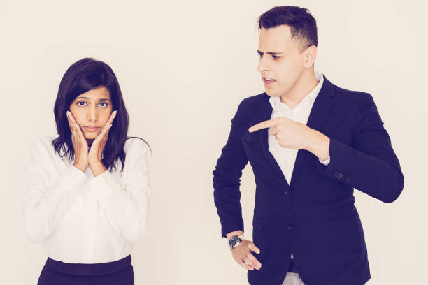 istock Angry young executive scolding his female employee 1056275102