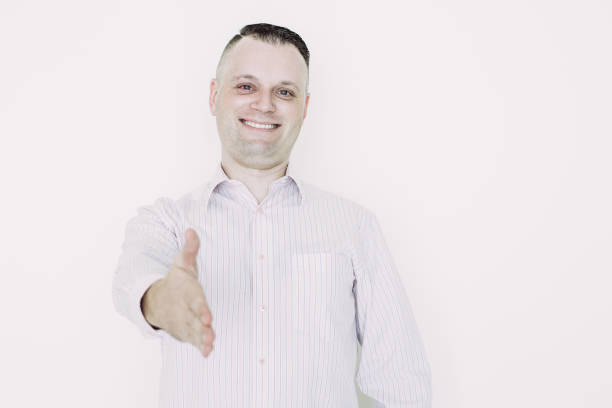 istock Happy businessman stretching hand for greeting 1056275108