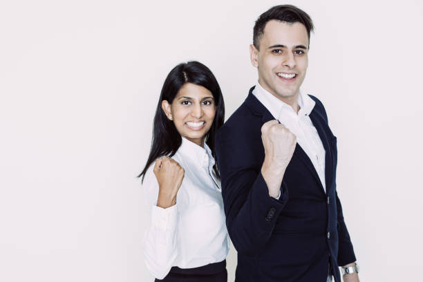 istock Successful young team showing winning gesture 1056276296