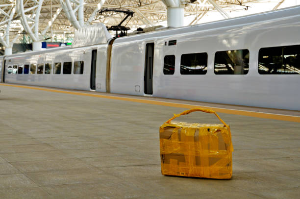 Carton package left at railway platform stock photo