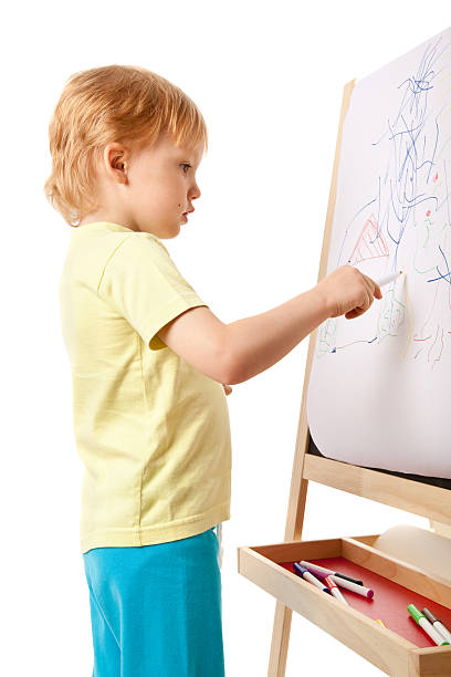 istock Four-year old boy drawing picture on easel 105627871