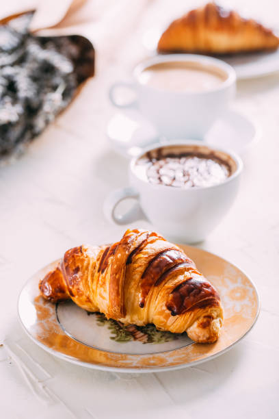 istock Delicious Croissant on Marble Table 1056280852