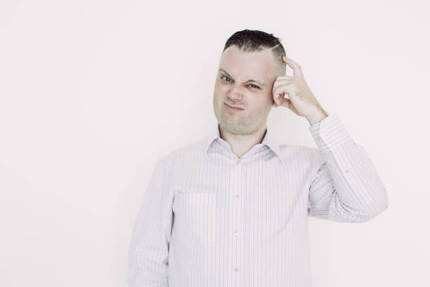 istock Displeased thoughtful man scratching head 1056281334