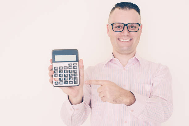 istock Cheerful man showing figure on calculator 1056281500