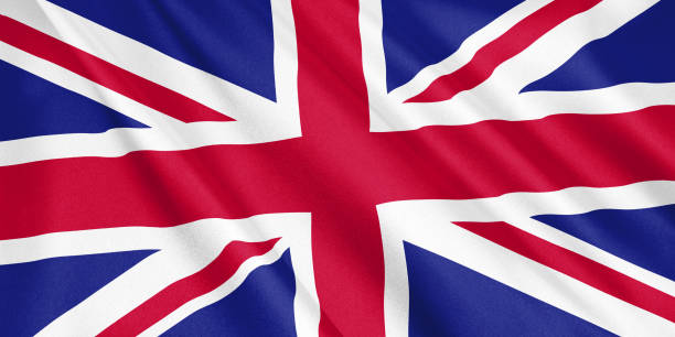 istock United Kingdom flag waving with the wind, wide format, 3D illustration. 3D rendering. 1056281540
