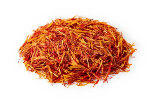 Safflower petals (Saffron substitute) Safflower petals (Saffron substitute) isolated on white background substitute for saffron stock pictures, royalty-free photos & images