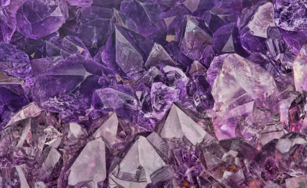 istock dark lilac amethyst crystals close-up backgrond 1056286318