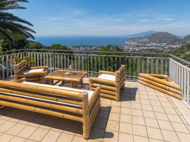 istock Romantic benches and a table on the terrace overlooking the Vesuvius 1056286440