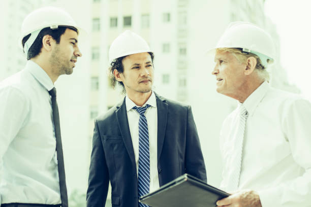 istock Two Engineers Meeting with Supervisor at Site 1056290274