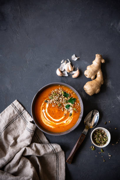 istock Pumpkin soup served with seeds and parsley. 1056292294
