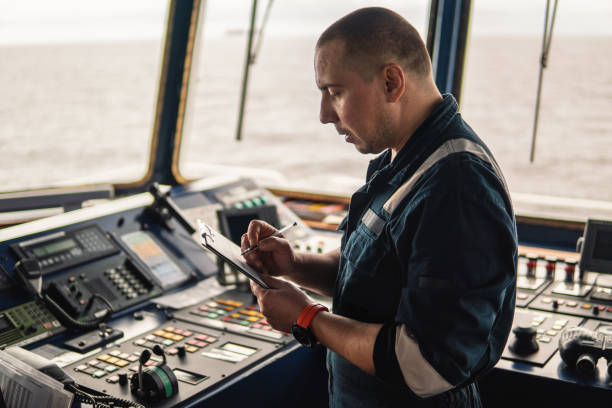 istock Marine navigational officer or chief mate on navigation watch 1056295986