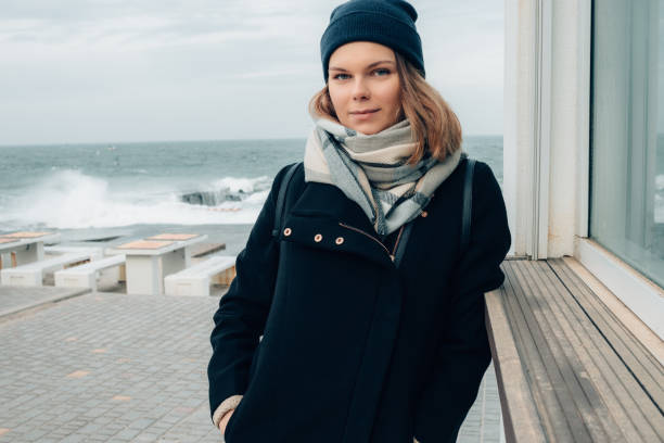 istock Happy stylish young woman wearing coat 1056296748