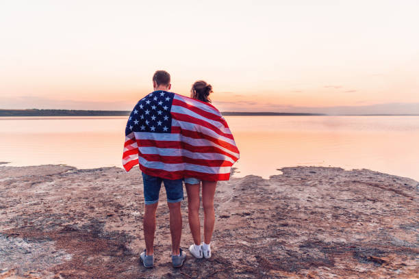 istock oung couple on the beach walking together 1056298958
