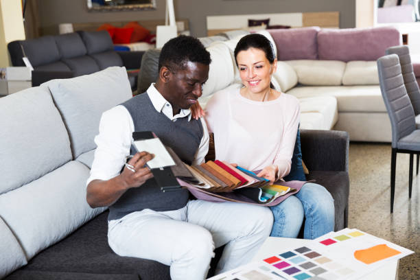 istock Couple choosing materials for furniture 1056301572