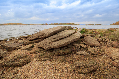 Flat stones on the lake shore