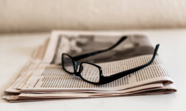 istock Spectacles or Glasses on Newspapers 1056301828