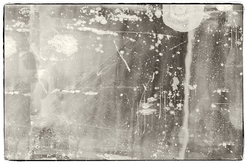 Worn and scrached old mirror surface with borders. For texture or background.
