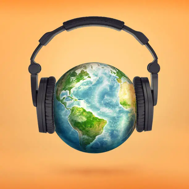 Photo of 3d rendering of large black headphones placed on an Earth globe pretending it's a head.