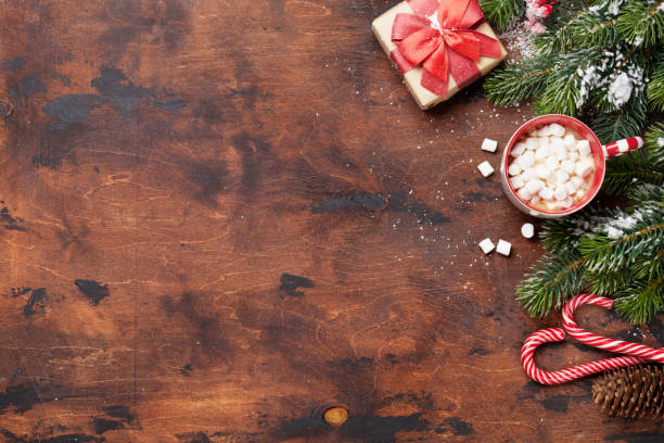 istock Christmas gift box, candy canes, hot chocolate with marshmallow 1056309582