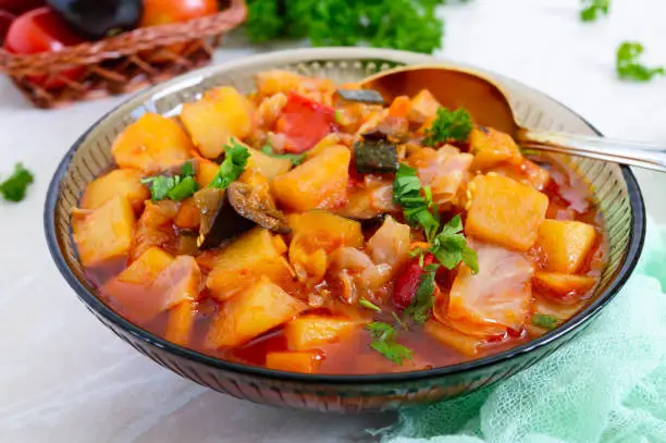 Photo of Delicious vegetable stew in a glass bowl. A popular dish of many countries of the world. Vegetarian menu