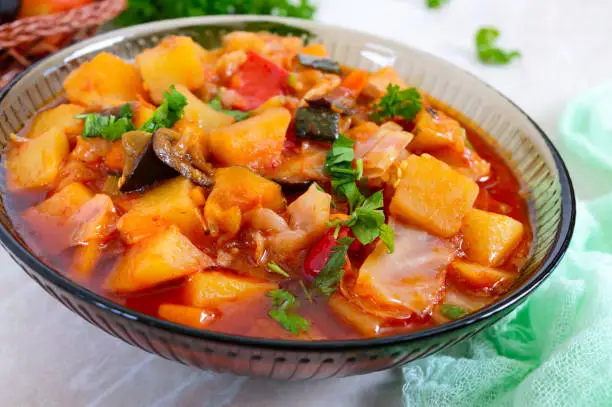 Photo of Delicious vegetable stew in a glass bowl. A popular dish of many countries of the world. Vegetarian menu