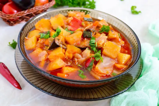 Photo of Delicious vegetable stew in a glass bowl. A popular dish of many countries of the world. Vegetarian menu